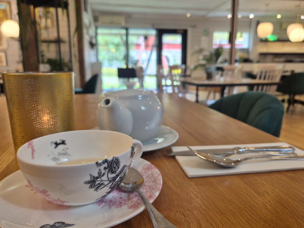 Tea and teapot on a table inside TeaHouse of Wehmais in Juva