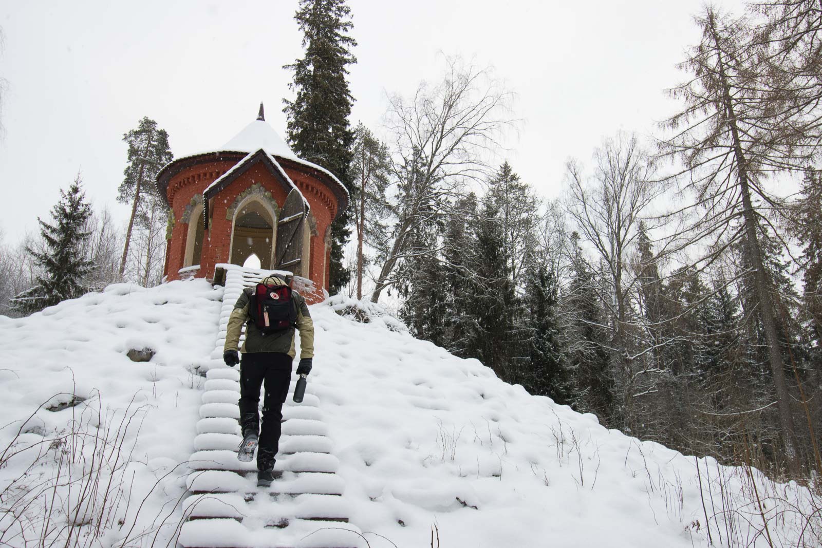 Person climbing the stairs to the Temple of Good Luck at Aulanko